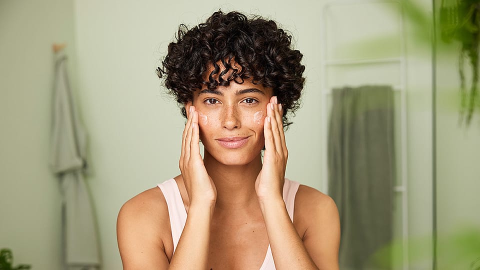 Woman touching face